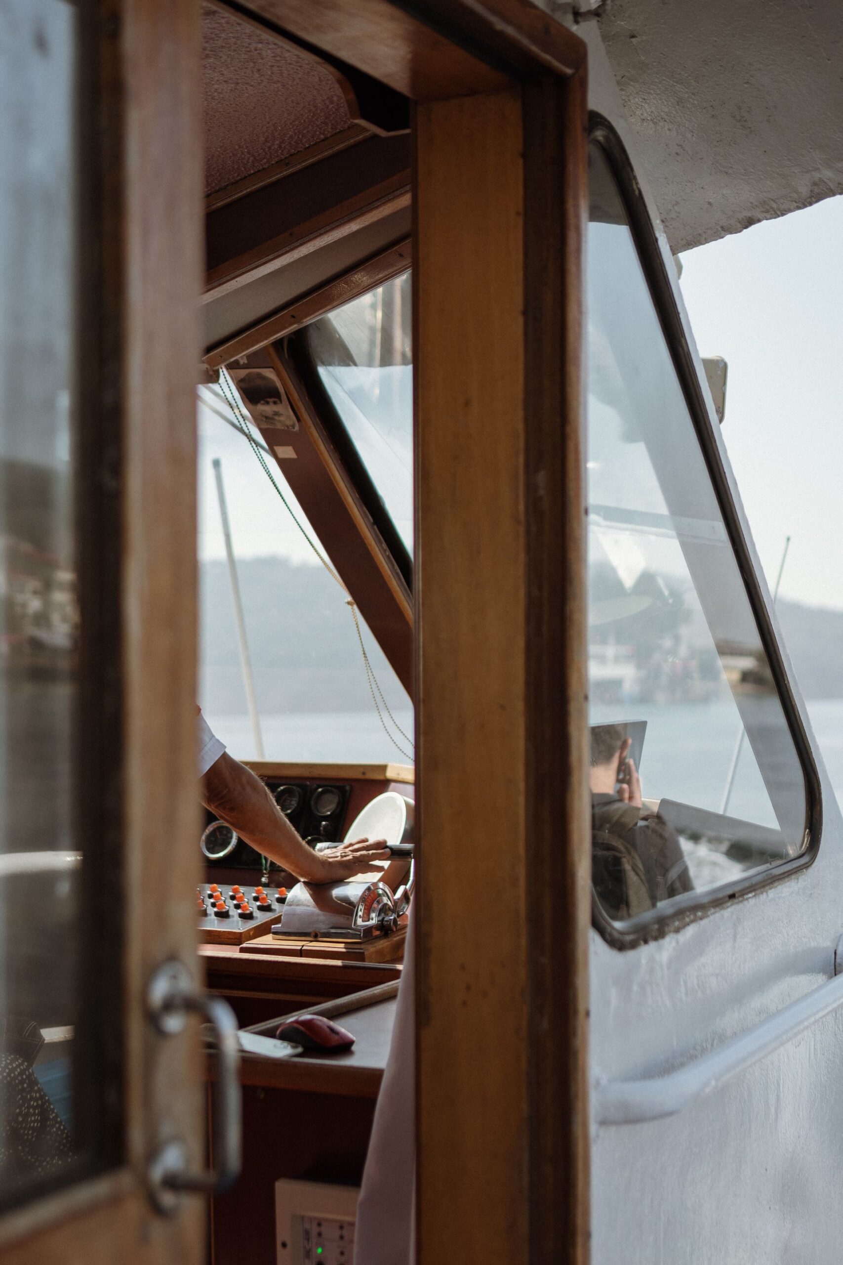 Hand waving from a canal boat deck on a sunny morning