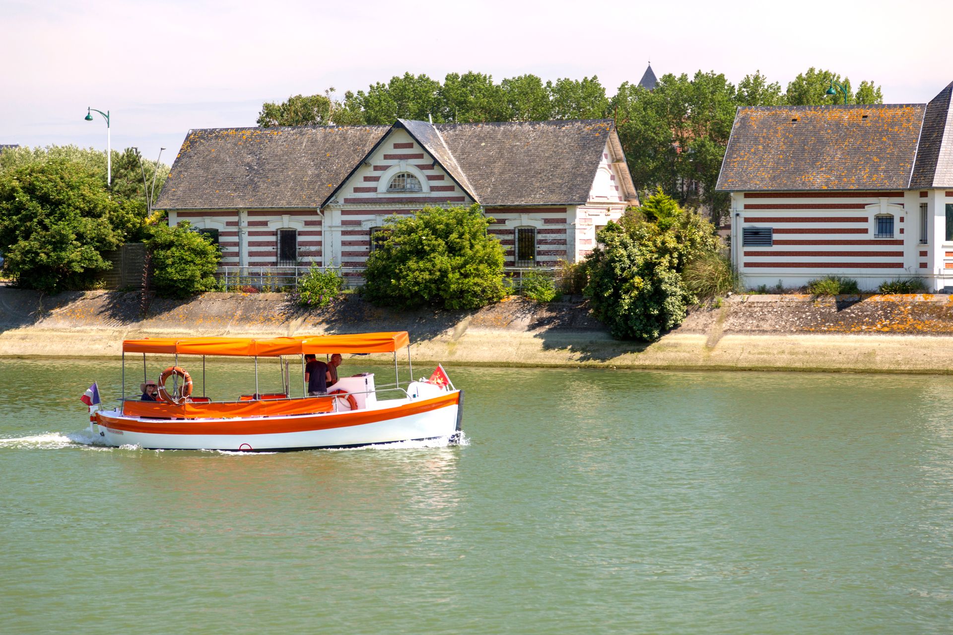 Canal boat cruising through the French countryside
