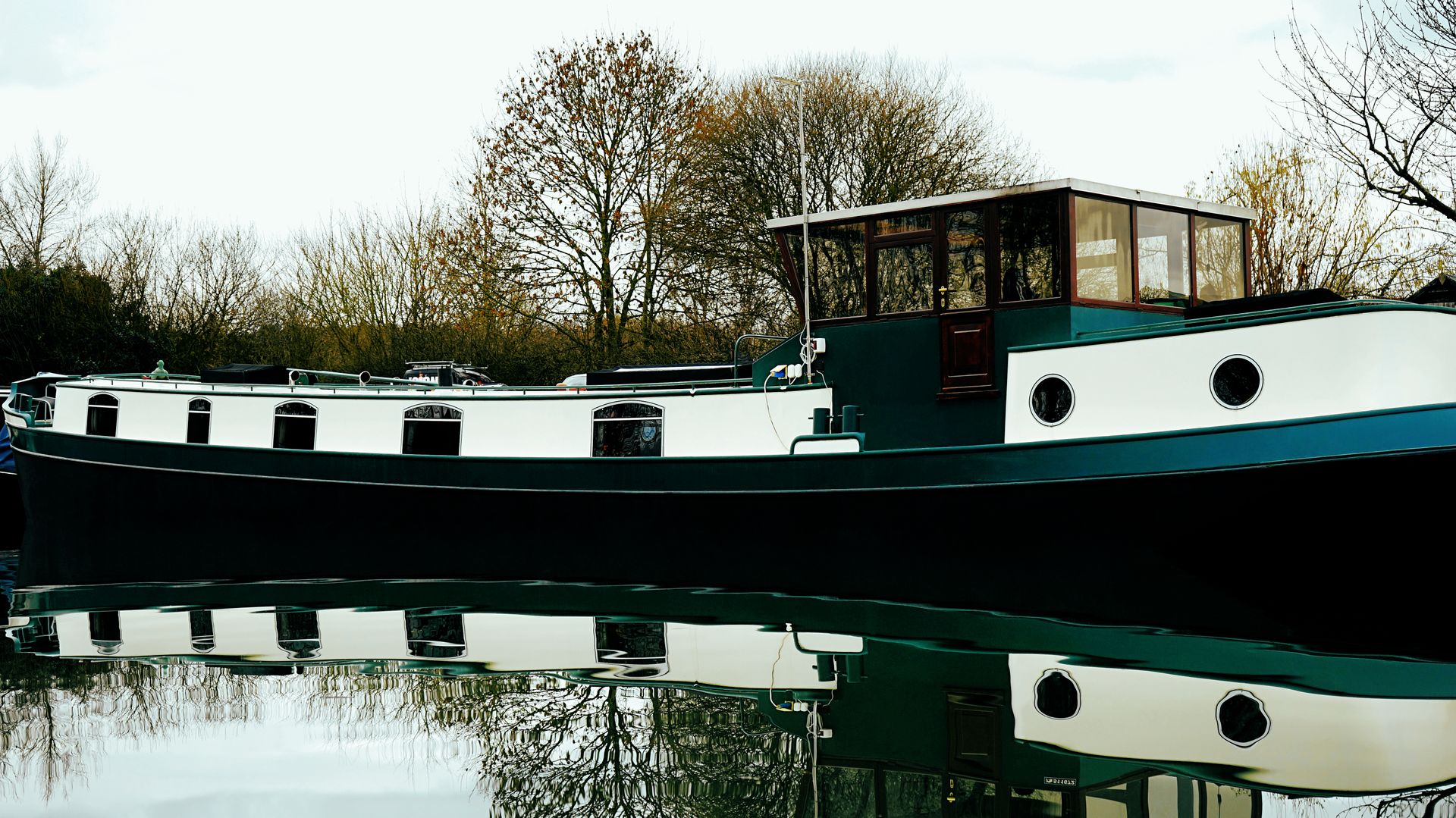 Family barge with wide deck on a canal